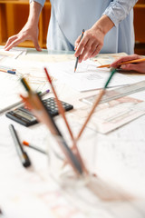Designers work on a blueprint of new apartments
