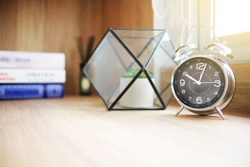 modern living relax corner with Book, clock and glass vase on wood table design, warming process style