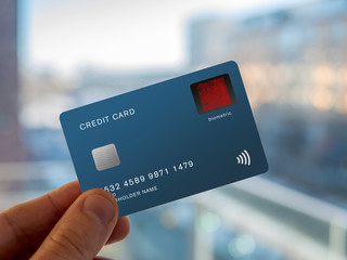 Credit card with a fingerprint sensor, biometric verification.