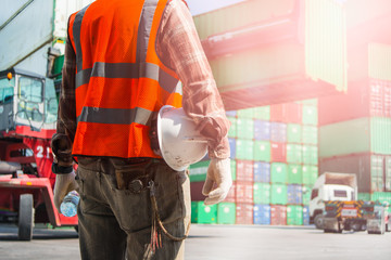 Employees who are inspecting container transportation