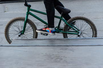 Rider on a bmx bike in skatepark