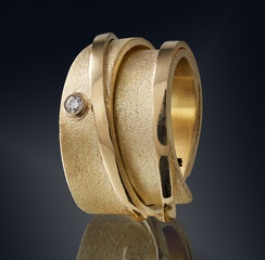 Golden ring with gemstone isolated on black background