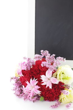 black board and flower bouquet for flower shop image