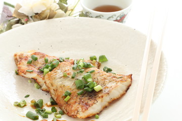 Chinese food, pan fried white fish and scallion