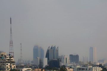 Soft focus of many small dust covered the big city. The dust is dangerous when breathing a lot. Building and health care concept. 