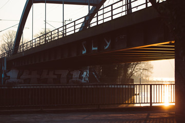 Balustrade and a rail bridge in the golden hour