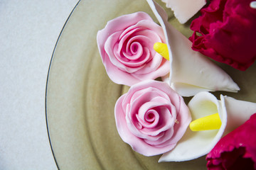 Flowers from sugar on a plate