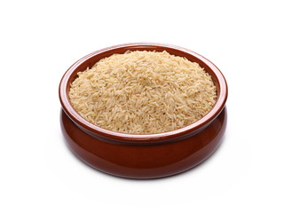 Integral, long grain brown rice pile in porcelain bowl isolated on white background