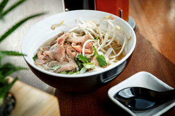 Ramen soup with veal meet and sprouted soybean in a bowl