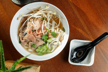 Ramen soup with veal meet and sprouted soybean in a bowl