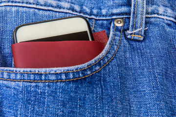 Cellphon and beautiful leather case in the jeans  pocket.