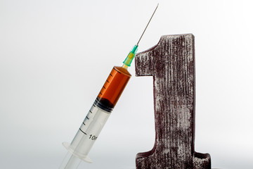 digit one and syringe with liquid