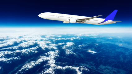 Obraz na płótnie Canvas Flying of a passenger plane over the land