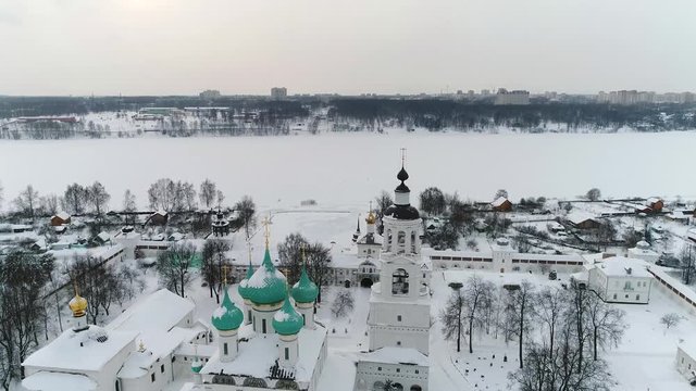 View from the heights to the Tolga convent in Yaroslavl on the banks of the Volga in winter. Russia