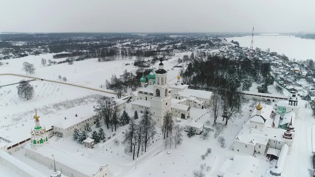 View from the heights to the Tolga convent in Yaroslavl on the banks of the Volga in winter. Russia