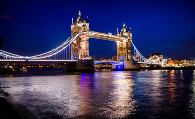 London cityscape with illuminated Tower Bridge over the River Thames