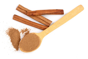 Cinnamon sticks with powder isolated on white background. Top view