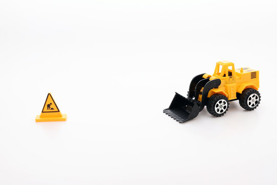 Construction bulldozers toy car.Under construction symbolic.Scene placing