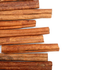 Cinnamon sticks isolated on white background with copy space for your text. Top view