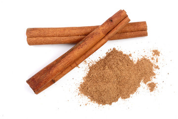 Cinnamon sticks with powder isolated on white background. Top view