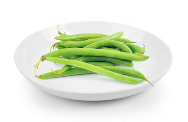 green beans in plate on white background