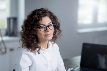 Portrait of a girl in the office.