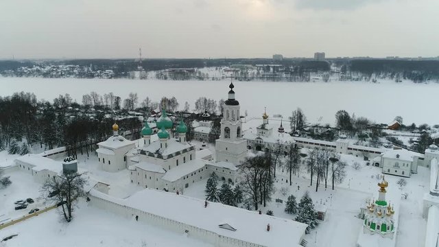 View from the heights to the Tolga convent in Yaroslavl on the banks of the Volga in winter. Russia