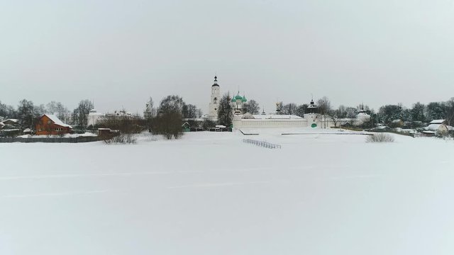 View from the heights to the Tolga convent in Yaroslavl on the banks of the Volga in winter. Russia