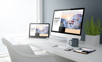 Fototapeta na wymiar grey studio devices with travel website