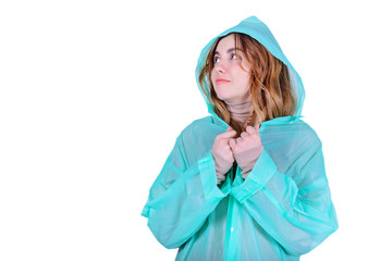 Young attractive woman in raincoat on white
