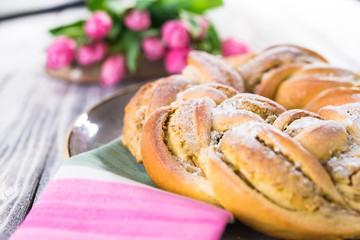 Sweet braided easter bread with marzipan and pistachio
