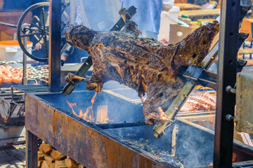 a whole lamb roasted on a spit, in the Hutsul region in Western Ukraine