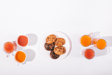 Glasses with juice and cookies on a plate
