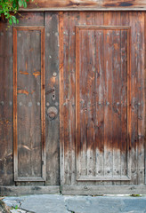 Fototapeta na wymiar Ancient brown wooden doow