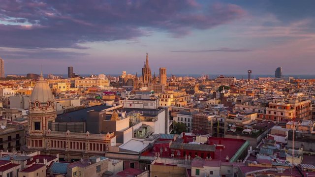 BARCELONA, CATALONIA - JULY 26th 2017: Timelapse of city centre from above rooftop architecture