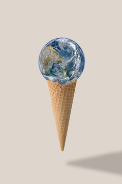 Earth on waffle cone. Environmental conservation concept. Elements of this image furnished by NASA.