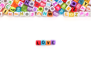 LOVE word and alphabet letter beads on white background for Valentine's day and love concept