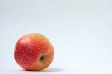 one red and yellow Apple on wite background 2