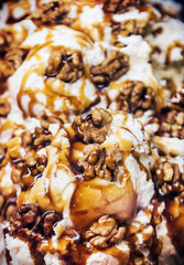 ice cream flavored with crÃ¨me brÃ»lÃ©e and walnut. Sweets and confectionery. Soft focus and shallow depth of field
