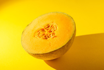 Cantaloupe on yellow background