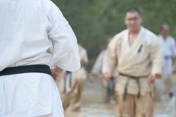 people practicing karate in the field