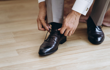 Dressing groom and preparing for ceremony 