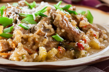 Risotto with champignon mushrooms, pork and parmesan