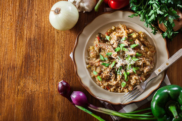 Risotto with champignon mushrooms, pork and parmesan