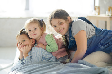 Fototapeta premium Two sisters and a brother.