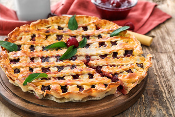 Delicious cherry pie on kitchen table