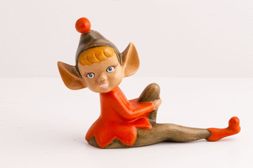 handmade sitting elf figurine in red and brown
