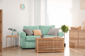 Living room interior with comfortable mint couch