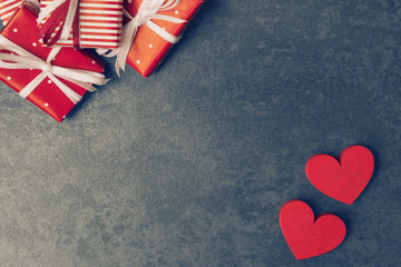 Stone background with gift boxes and hearts on Valentines day.