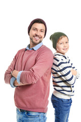 Stylish father and son on white background
